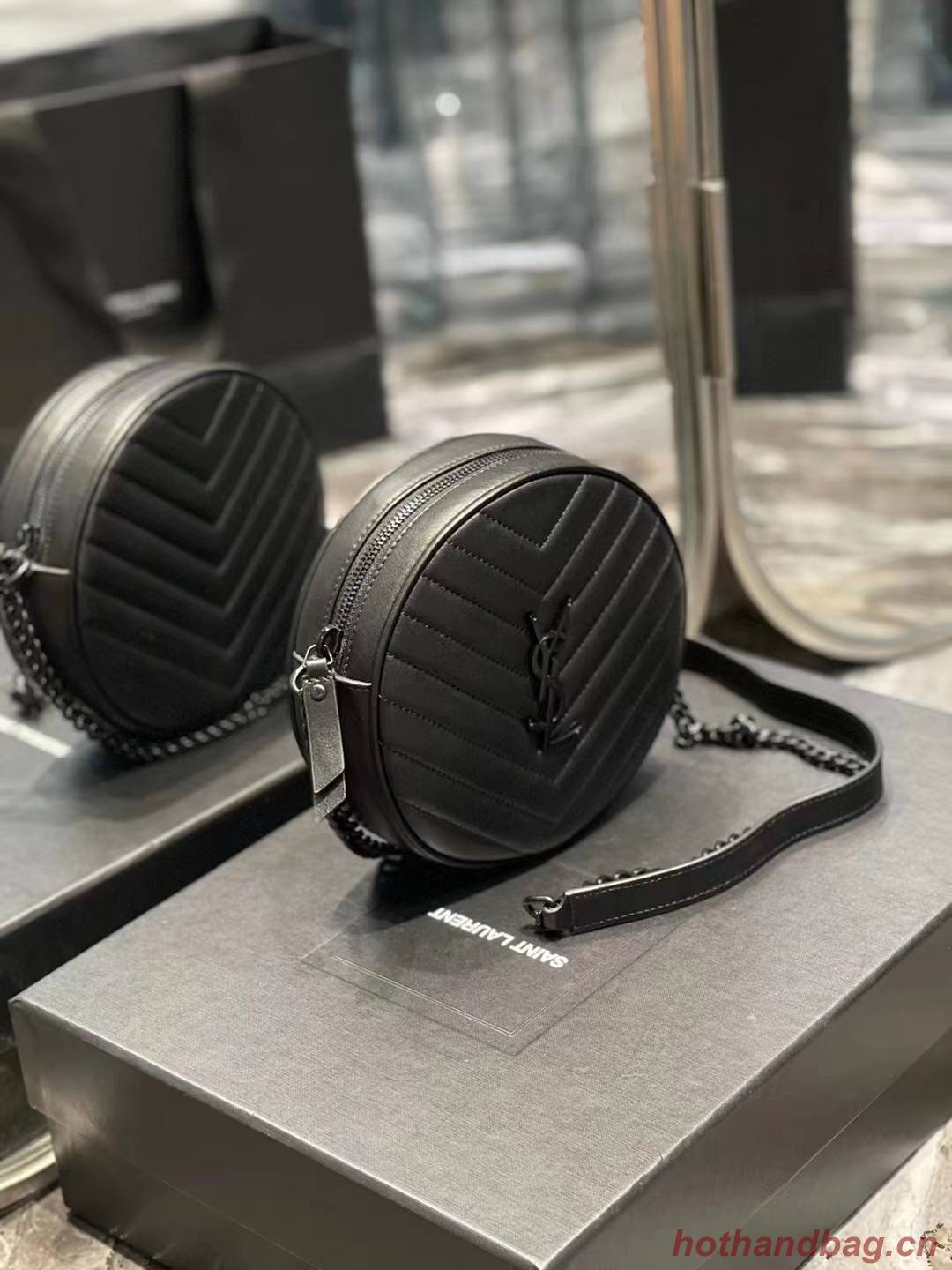 SAINT LAURENT VINYLE ROUND CAMERA BAG IN CHEVRON-QUILTED GRAIN DE POUDRE EMBOSSED LEATHER 6104361 black SAINT LAURENT VINYLE ROUND CAMERA BAG IN CHEVRON-QUILTED GRAIN DE POUDRE EMBOSSED LEATHER 6104361 black