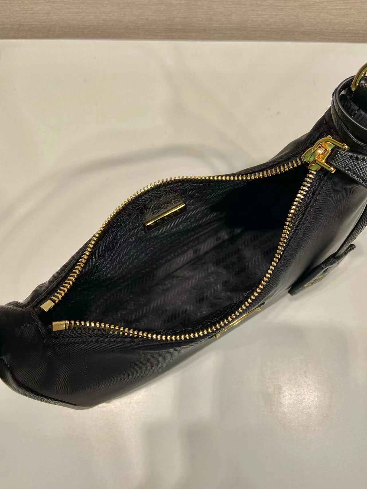 Prada Re-Nylon and brushed leather mini-bag 1BC515 black Prada Re-Nylon and brushed leather mini-bag 1BC515 black